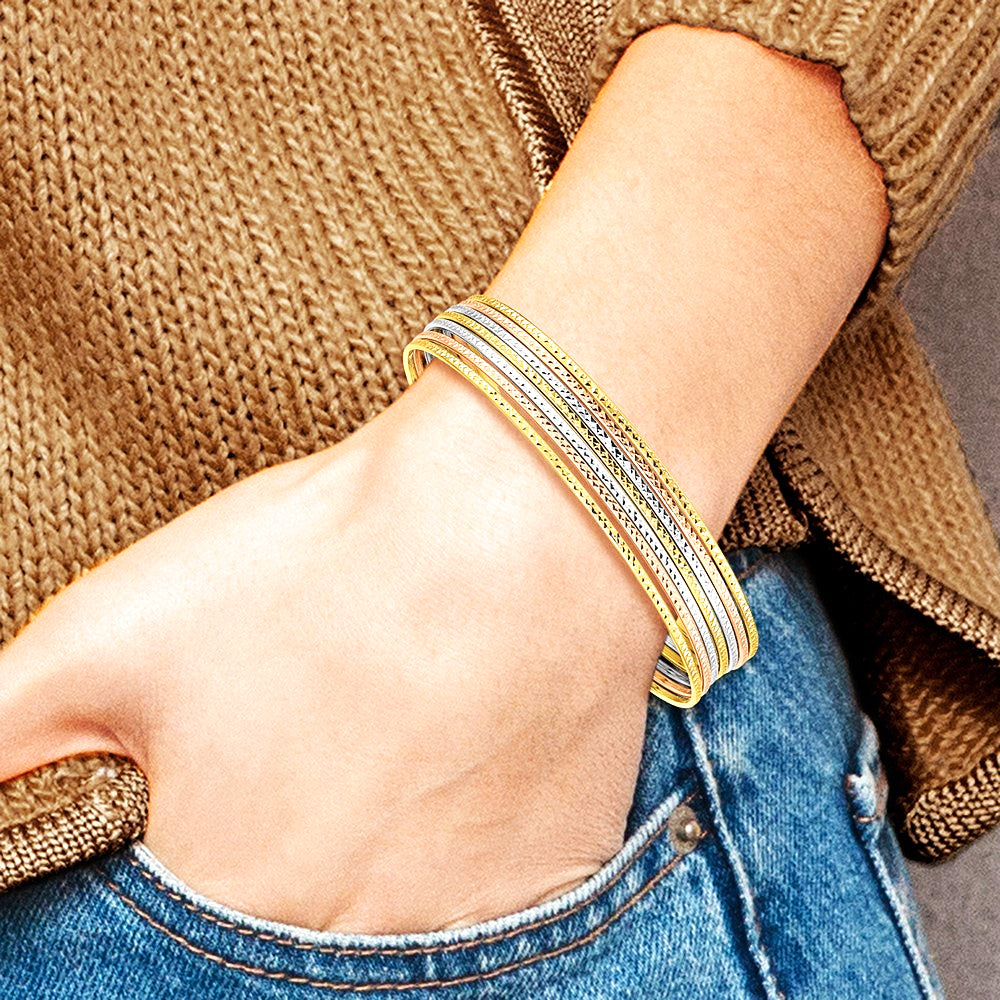 14K Tri-Color with Dangle Heart Tri-color Set of 7 Textured Slip-on Bangles - Product Photo