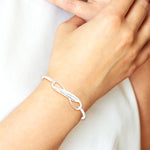 Sterling Silver Infinity with Feather Bangle Bracelet - Product Photo