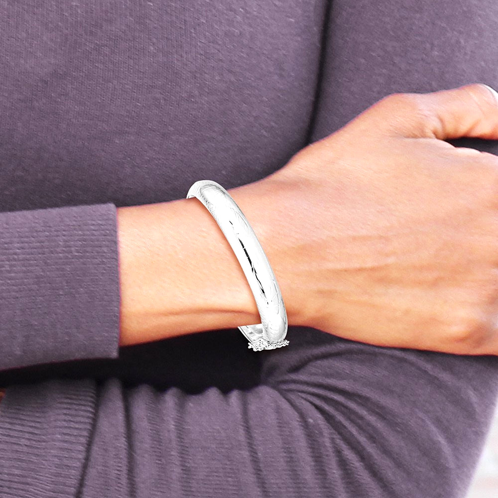 Sterling Silver Rhodium-plated Diamond-Cut 10.25mm Hinged Bangle Bracelet - Product Photo