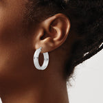 Sterling Silver Polished and Textured Circle Hoop Earrings - Product Photo