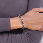 Sterling Silver Rhodium-plated CZ Paw Print & Dog Bone Adj Bracelet - Product Photo