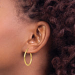 14K Yellow Gold Polished 2x25mm Lightweight Tube Hoop Earrings - Product Photo