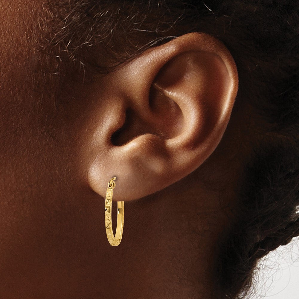 14K Yellow Gold Diamond Cut Oval Hollow Hoop Earrings - Product Photo