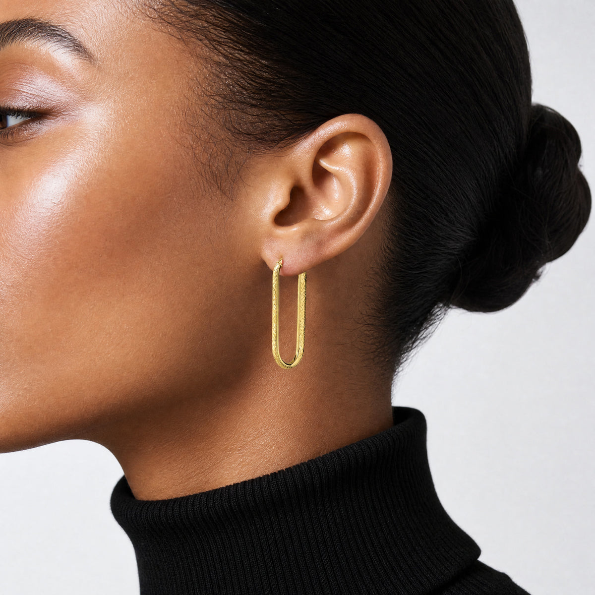 Leslie's 10K Polished and Diamond-cut Oval Hoop Earrings - Model Shot