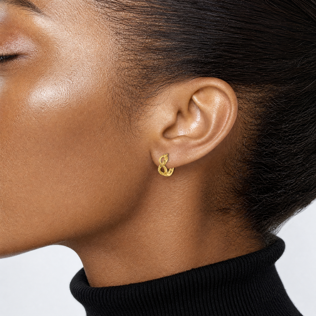 Leslie's 10K Polished and Diamond-cut Infinity Huggie Hoop Earrings - Model Shot
