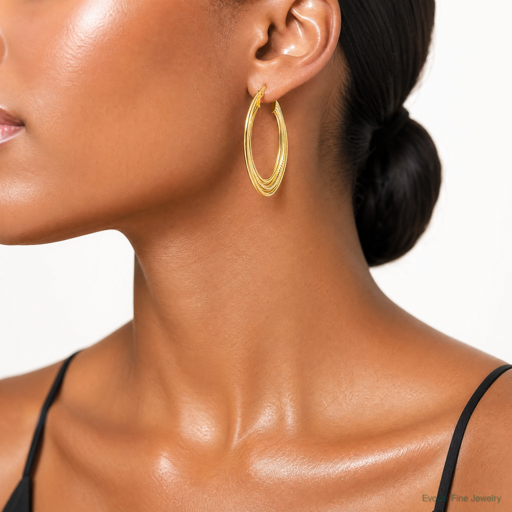 Leslie's 10k Polished and Textured Triple Oval Twist Hoop Earrings - Model Shot