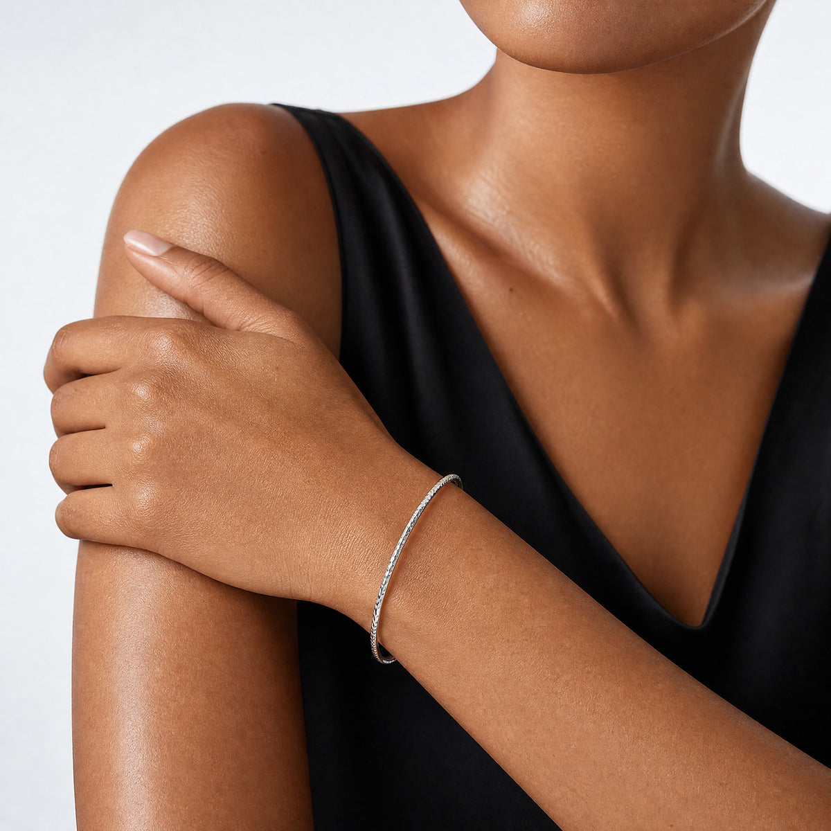 14k White Gold 2mm Diamond-cut Slip-on Bangle - Model Shot