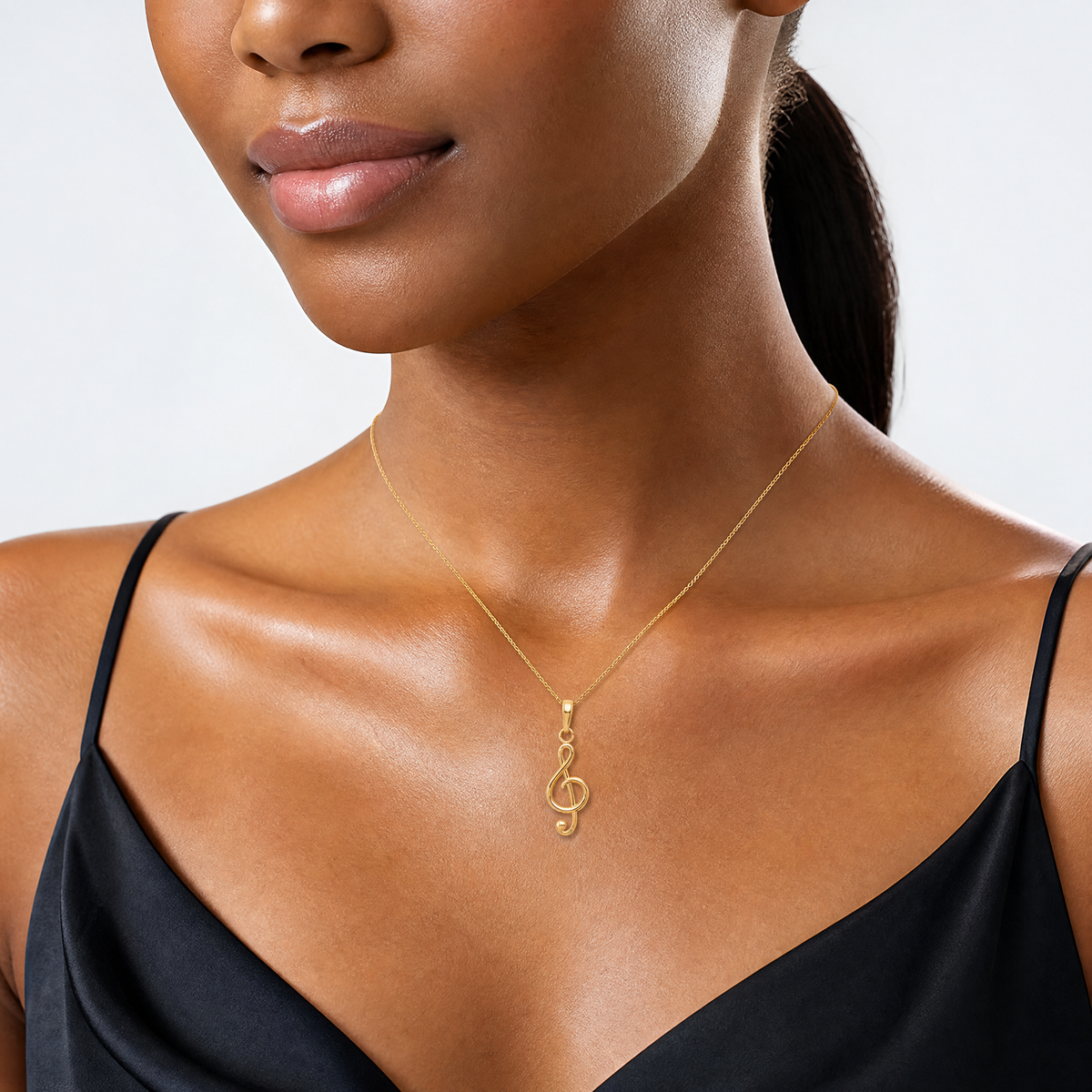 14k Polished Open-Backed Treble Clef Pendant - Model Shot