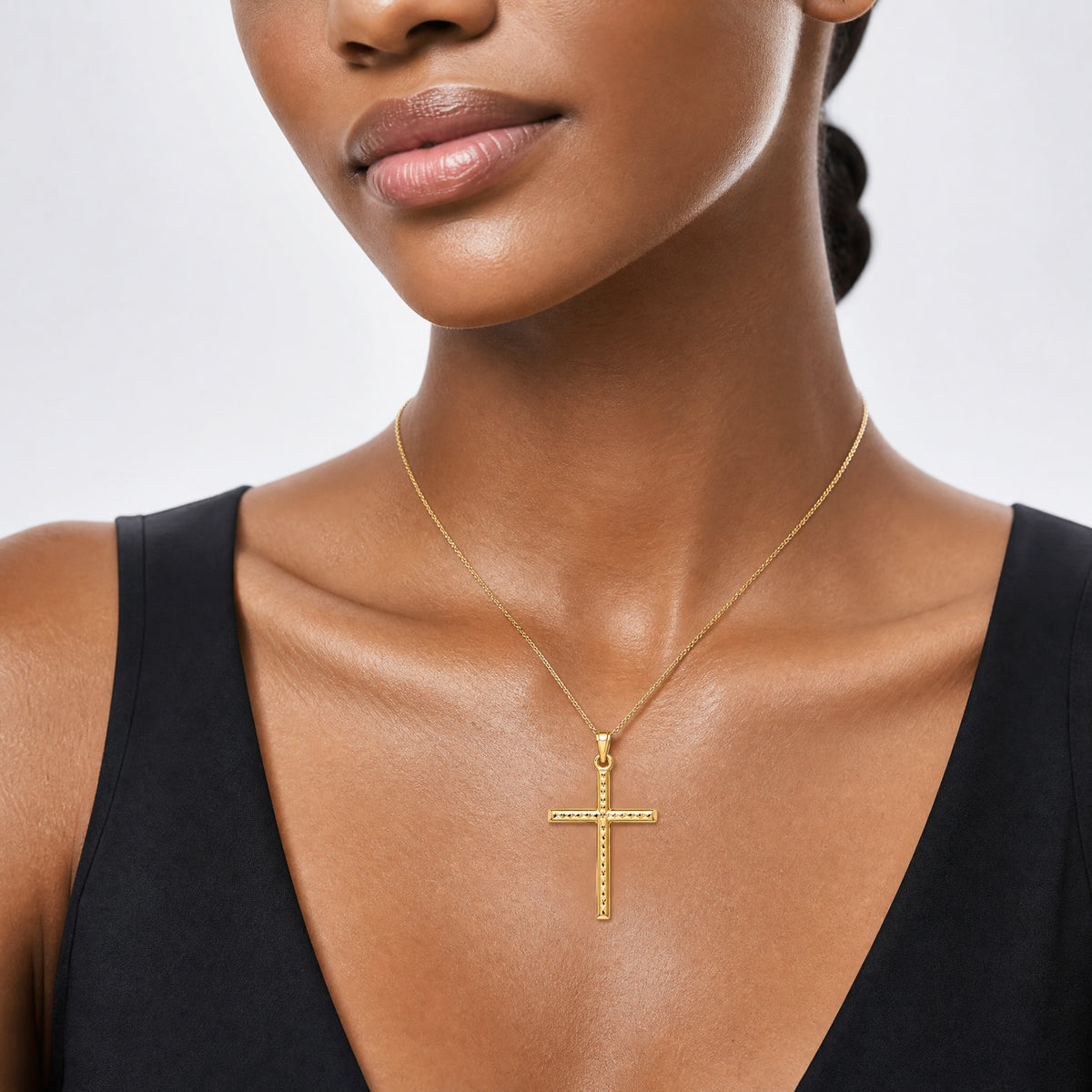 14k Hollow Diamond-cut Cross Pendant - Model Shot