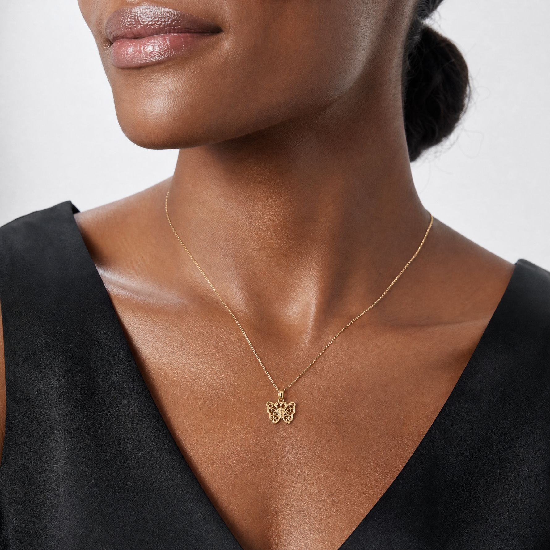 14K Cut-Out Small Butterfly Charm - Model Shot