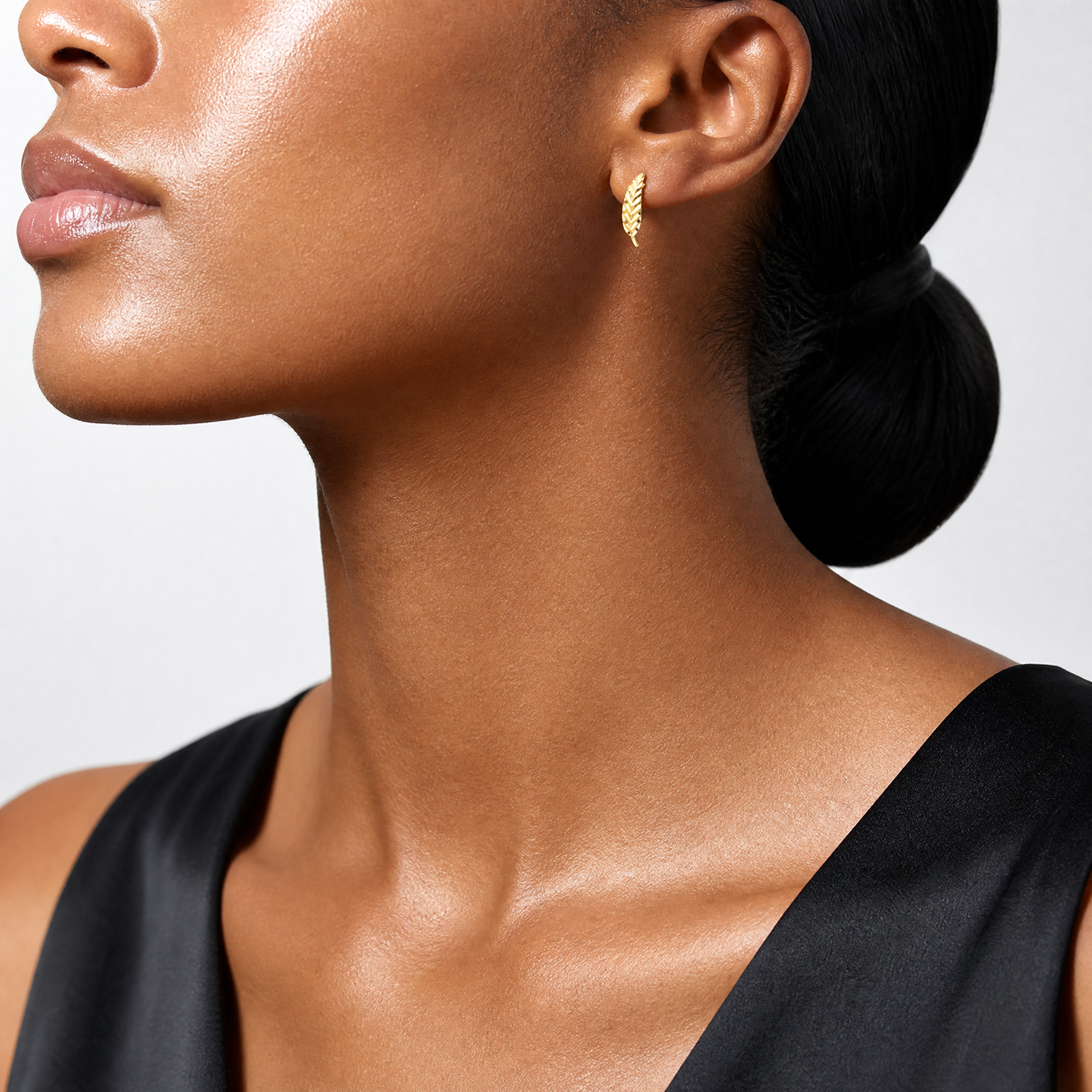 Leslie's 14K Polished and Diamond-cut Leaf Post Earrings - Model Shot
