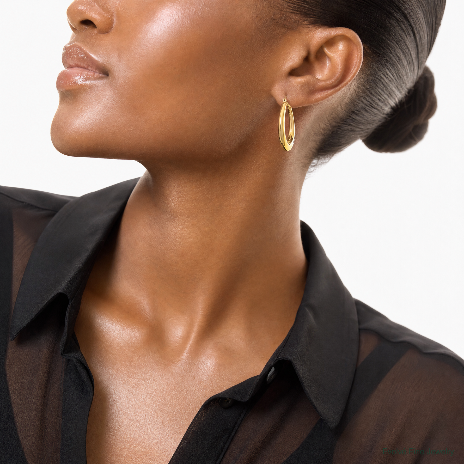 Leslie's 14K Polished Oval Hollow Hoop Earrings - Model Shot