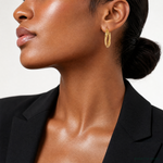 14k Textured and Polished Twist Oval Hoop Earrings - Model Shot
