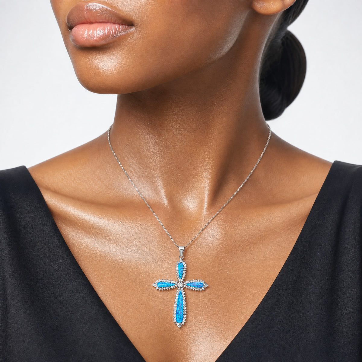 Sterling Silver RH-plated Blue Created Opal & CZ Border Cross Pendant - Model Shot