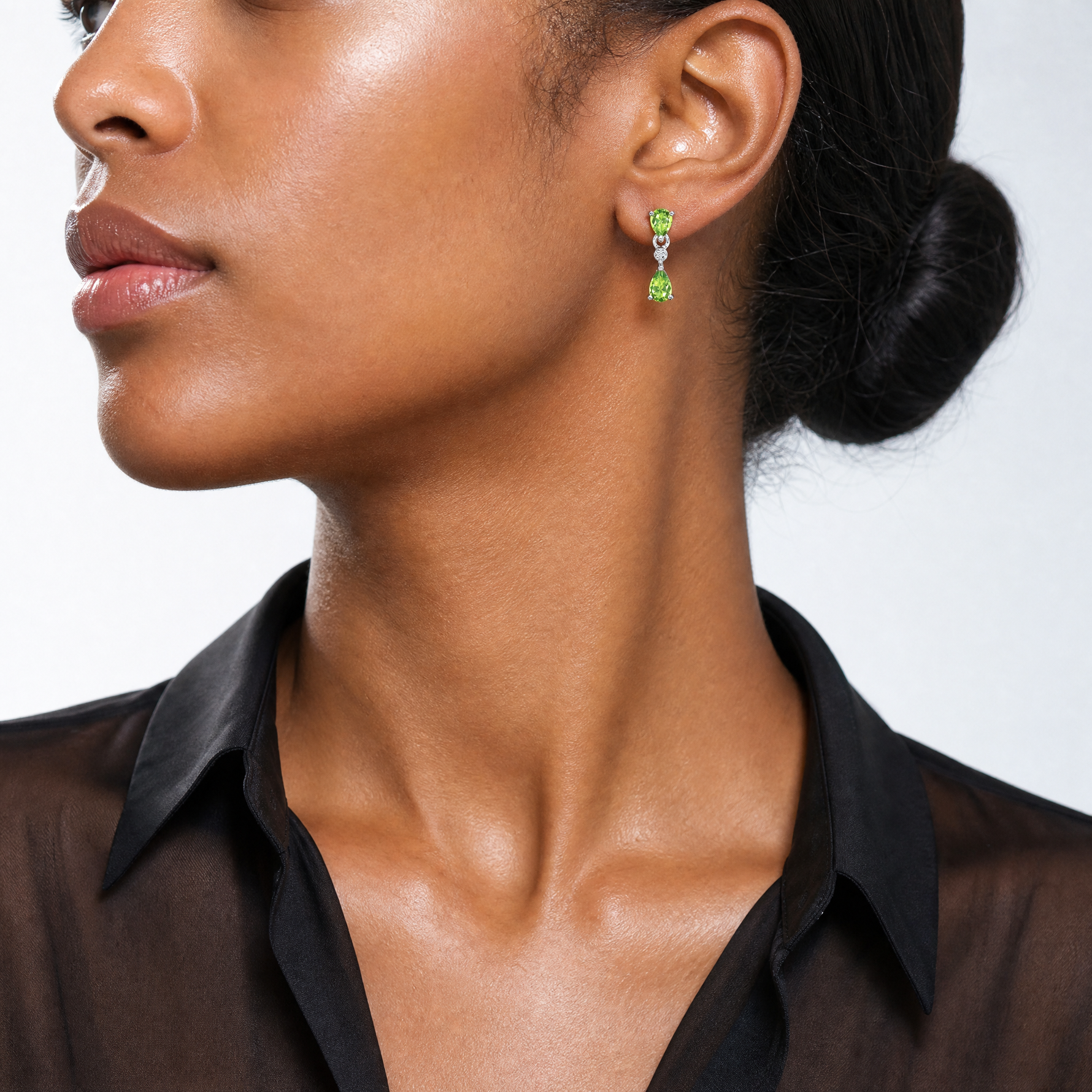 Sterling Silver Rhodium Plated Pear Peridot and Diamond Post Earrings - Model Shot