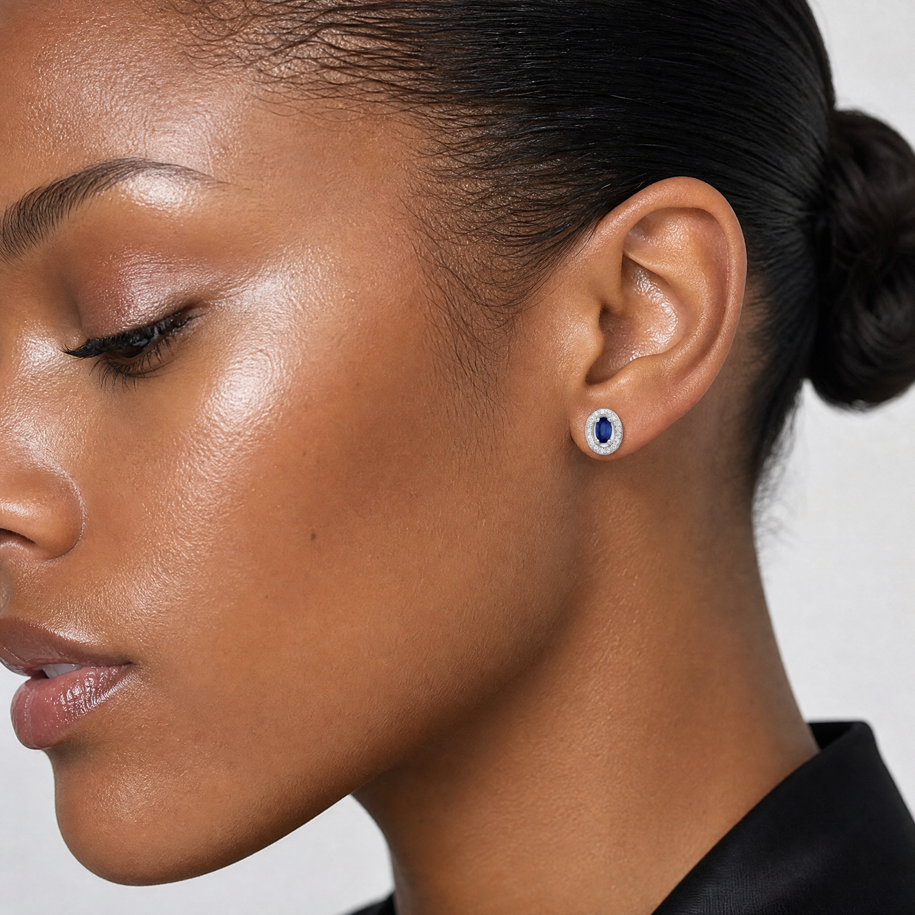 Sterling Silver Rhod-plated Blue and White CZ Oval Stud Earrings - Model Shot