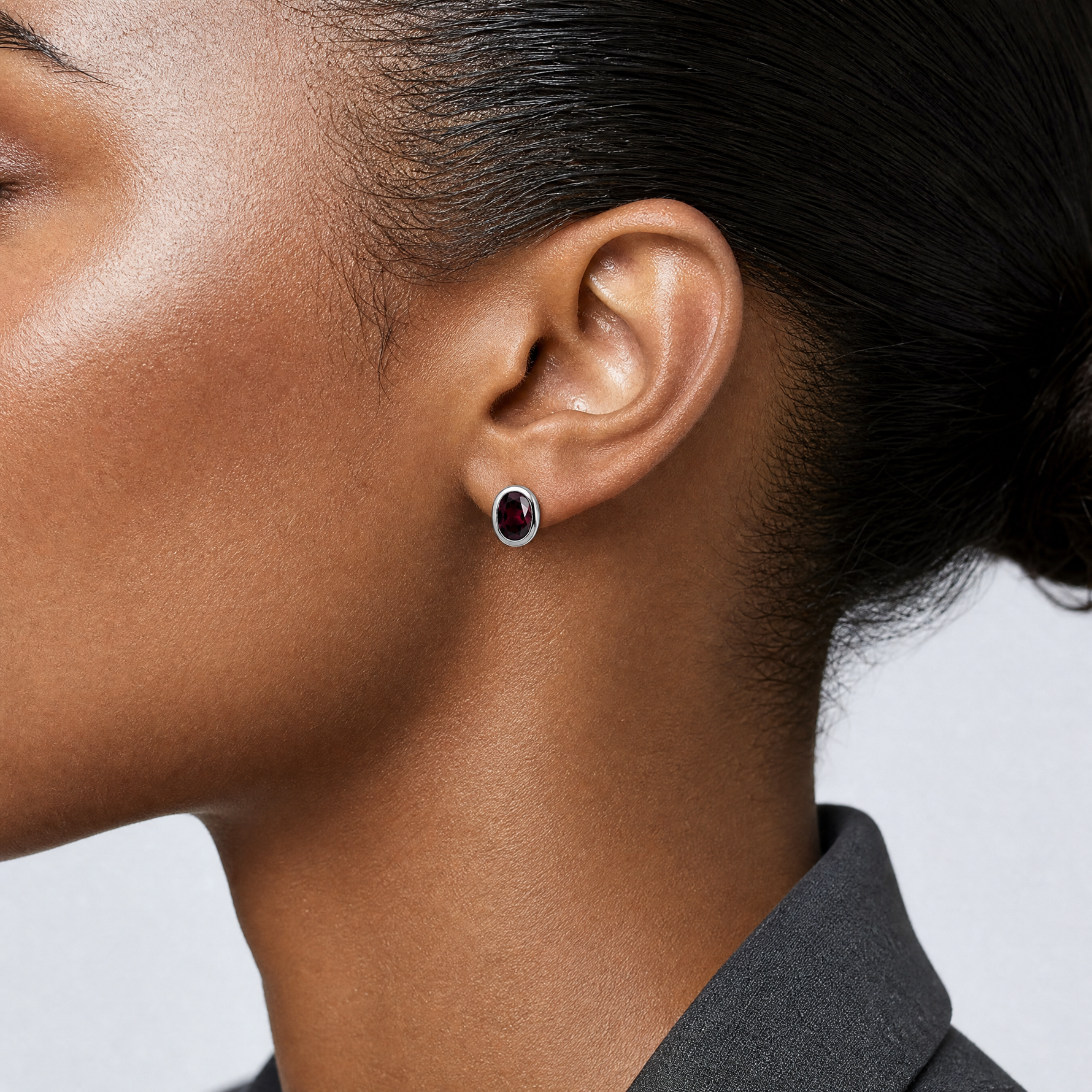 Sterling Silver Rhodium-plated Polished Garnet Oval Post Earrings - Model Shot