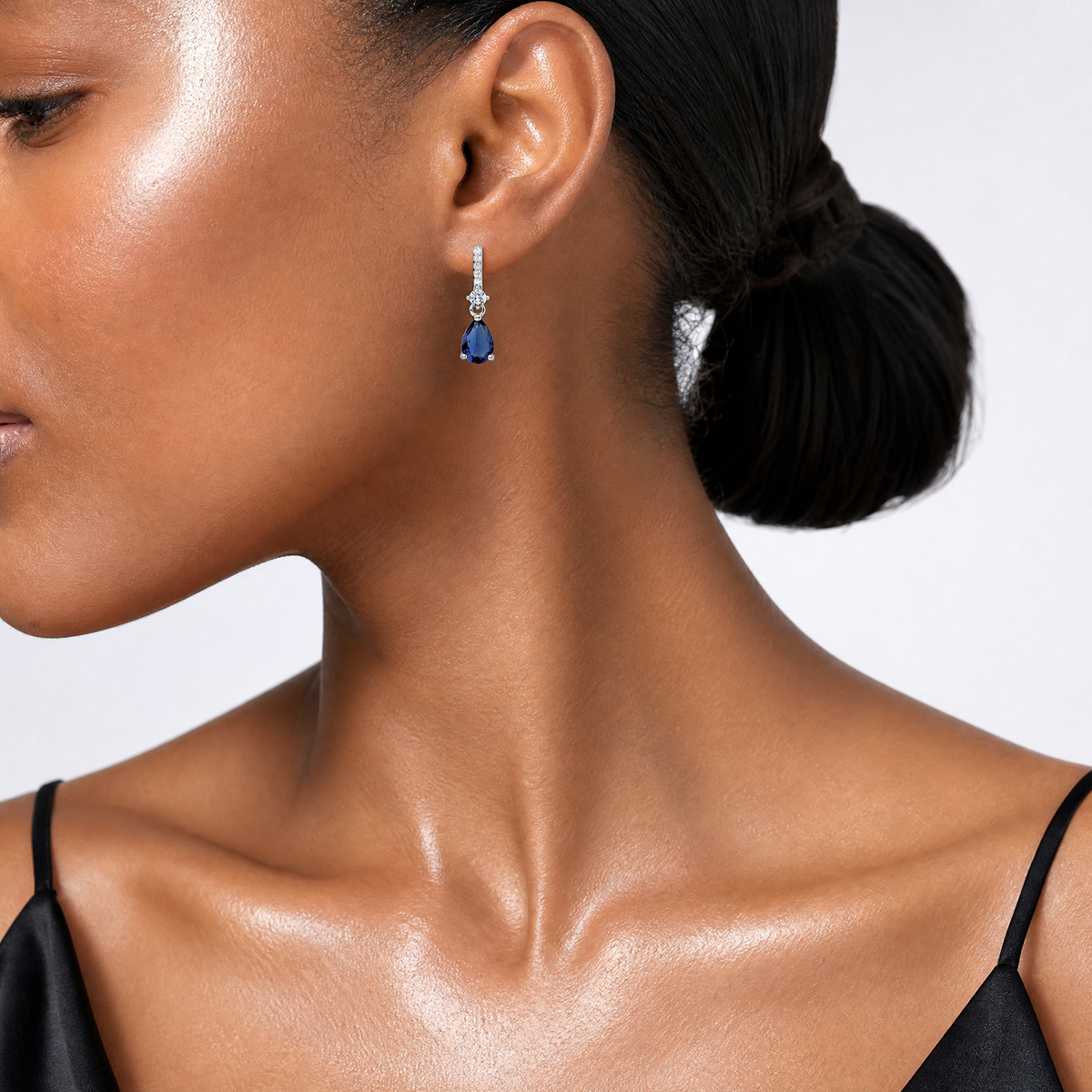 Sterling Silver Rhodium-plated CZ and Blue Glass Post Dangle Earrings - Model Shot