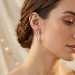 Sterling Silver Polished Oval Hoop Earrings - Model Shot
