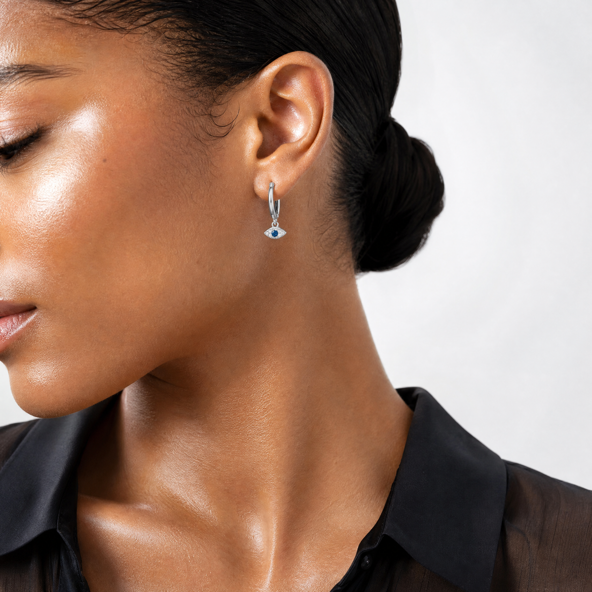 Sterling Silver RH-plated Blue & White CZ Evil Eye Dangle Hoop Earrings - Model Shot