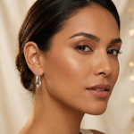 Sterling Silver Polished & Twisted Oval Hoop Earrings - Model Shot