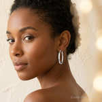 Sterling Silver Rhodium-plated Beveled Edge 4mm Oval Hoop Earrings - Model Shot