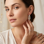 Sterling Silver RH-plated Polished/Satin Twisted Oval Hoop Earrings - Model Shot