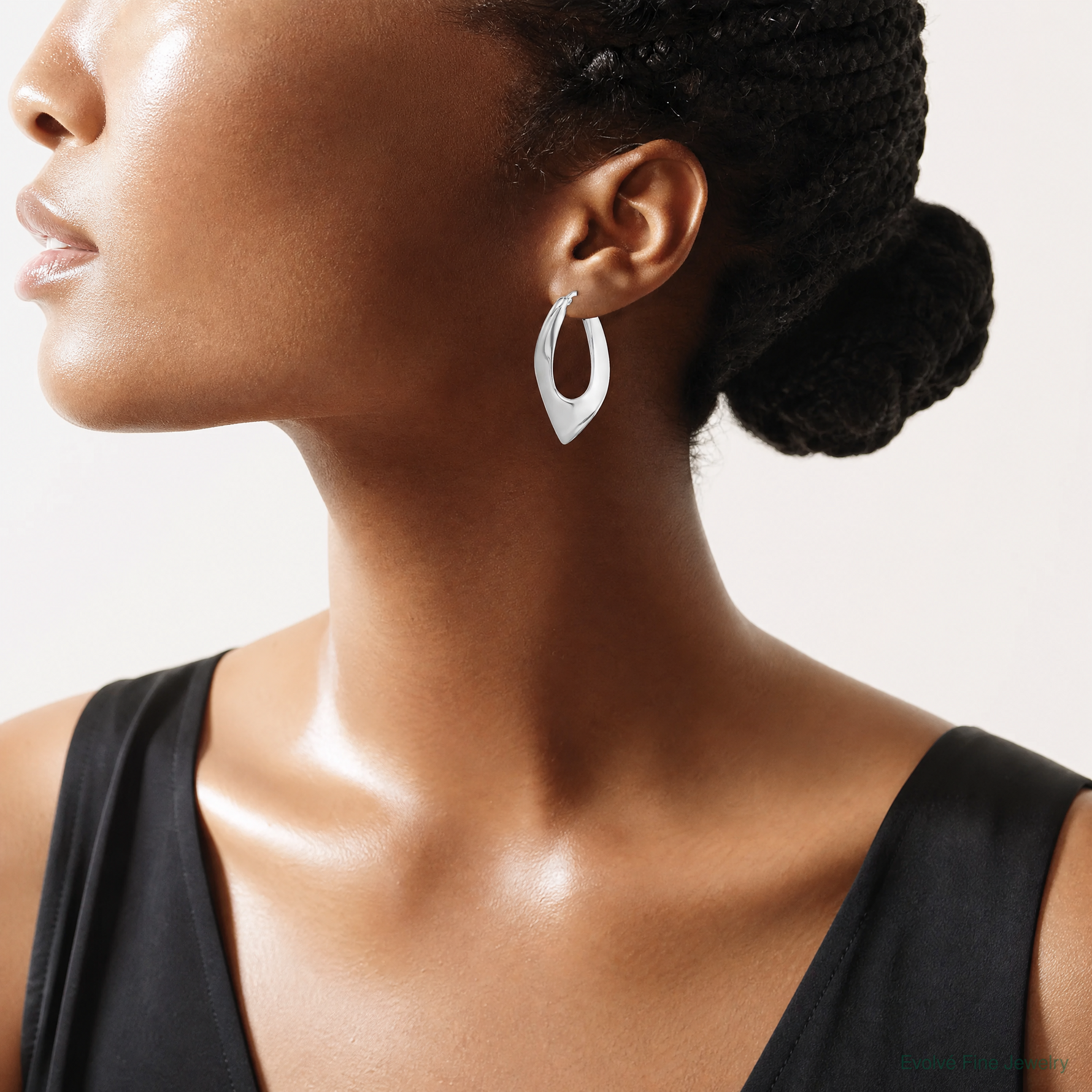 Sterling Silver RH-plated Polished Hollow Twisted Oval Hoop Earrings - Model Shot