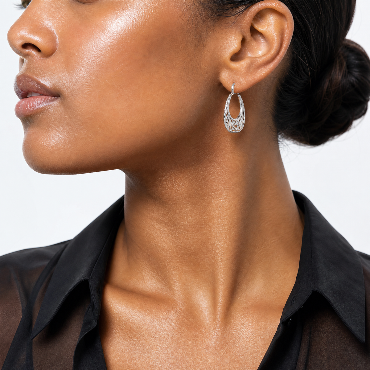 Sterling Silver Polished Filigree Oval Hoop Earrings - Model Shot