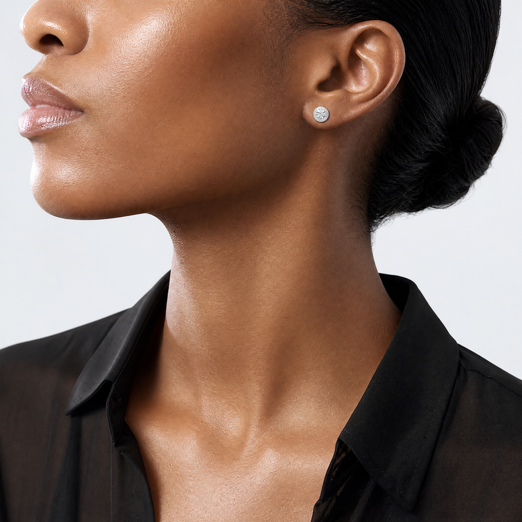 Sterling Silver Rhodium Plated 7mm Diamond Cut Post Earrings - Model Shot