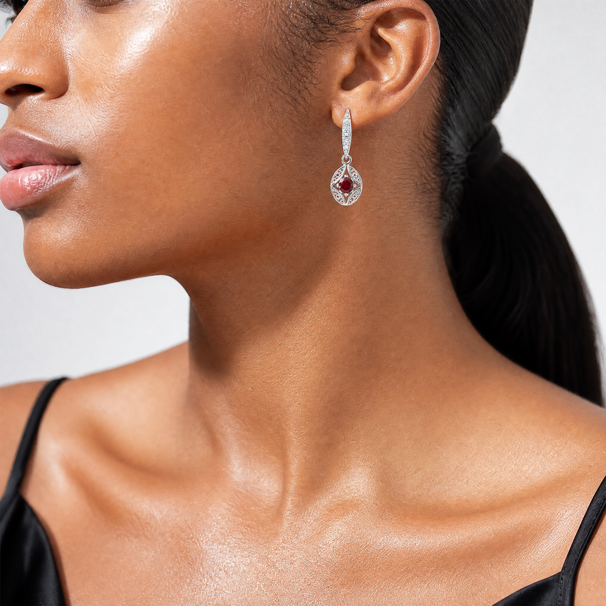 Sterling Silver Rhodium-plated Garnet and Diamond Dangle Earrings - Model Shot