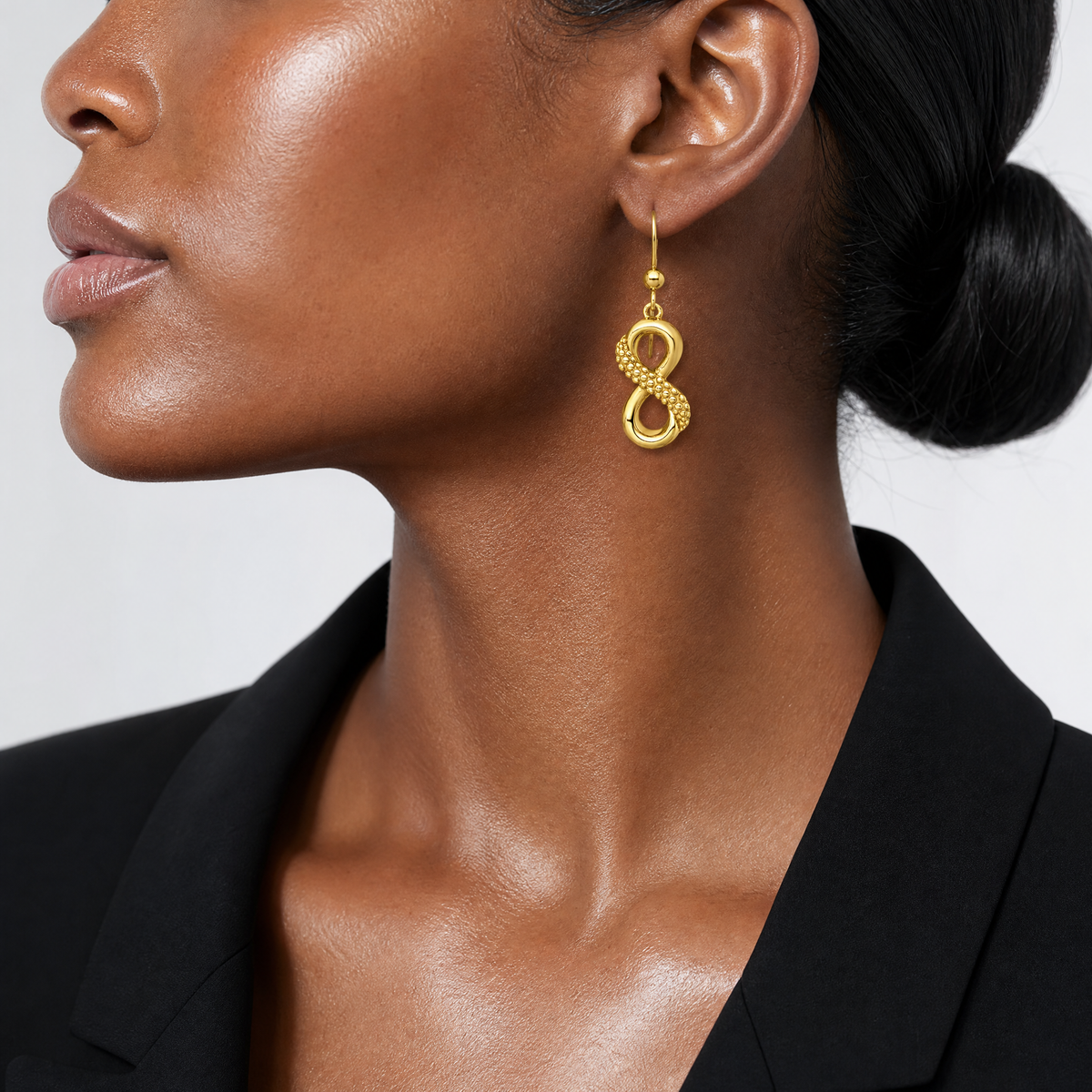 Sterling Silver Gold-tone Polished and Textured Infinity Dangle Earrings - Model Shot