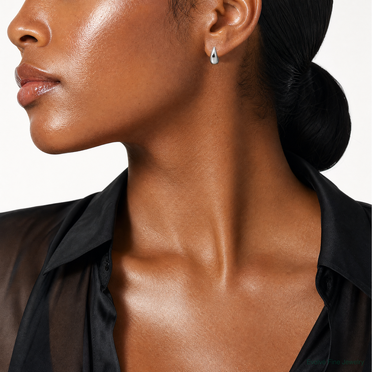 Leslie's Sterling Silver RH-plated Polished Puffed Teardrop Post Earrings - Model Shot