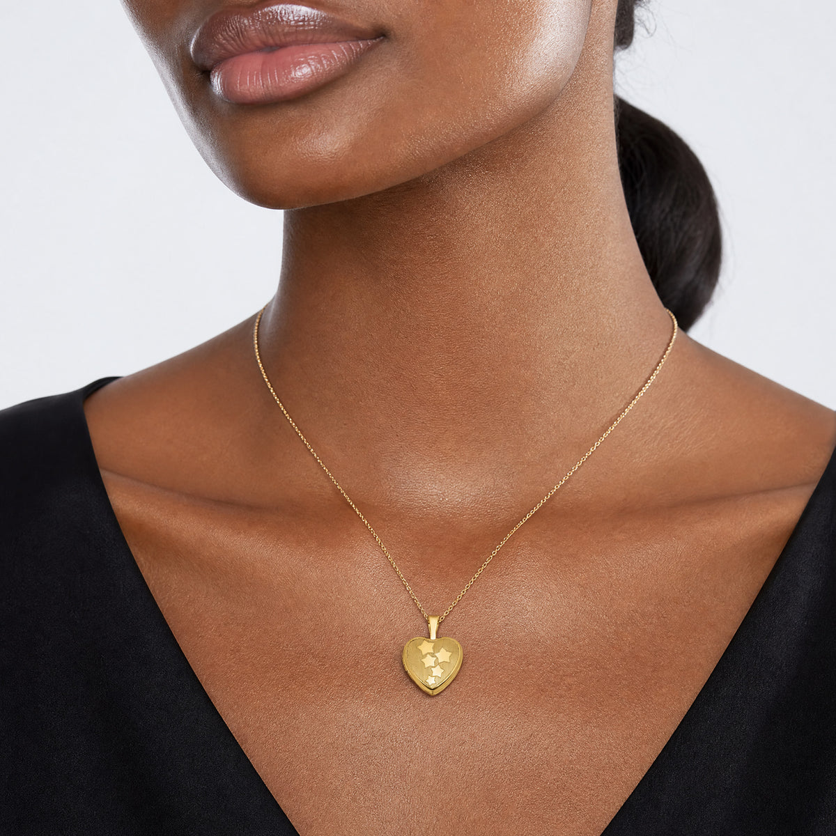Sterling Silver Gold-plated Brushed And Polished Stars 12mm Heart Locket - Model Shot
