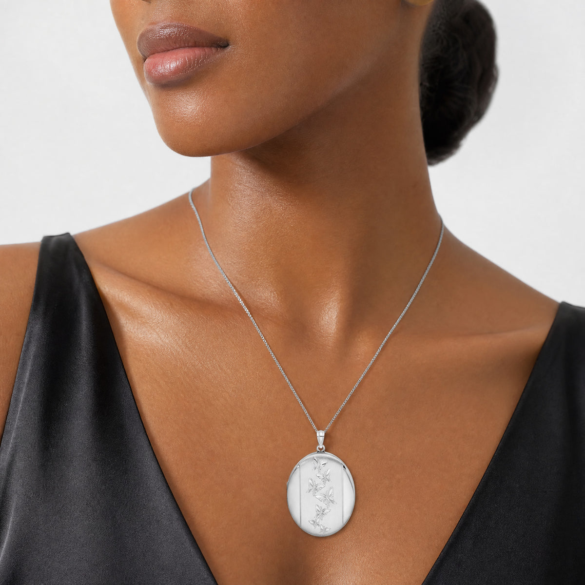 Sterling Silver Rhodium-plated Butterflies 34mm Oval Locket - Model Shot