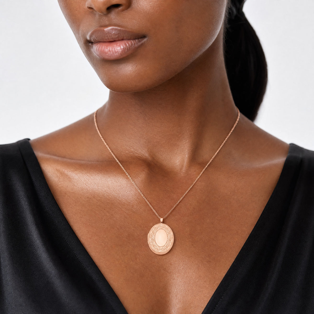 Sterling Silver Rose Gold-plated 26mm Leaf Border Oval Locket - Model Shot
