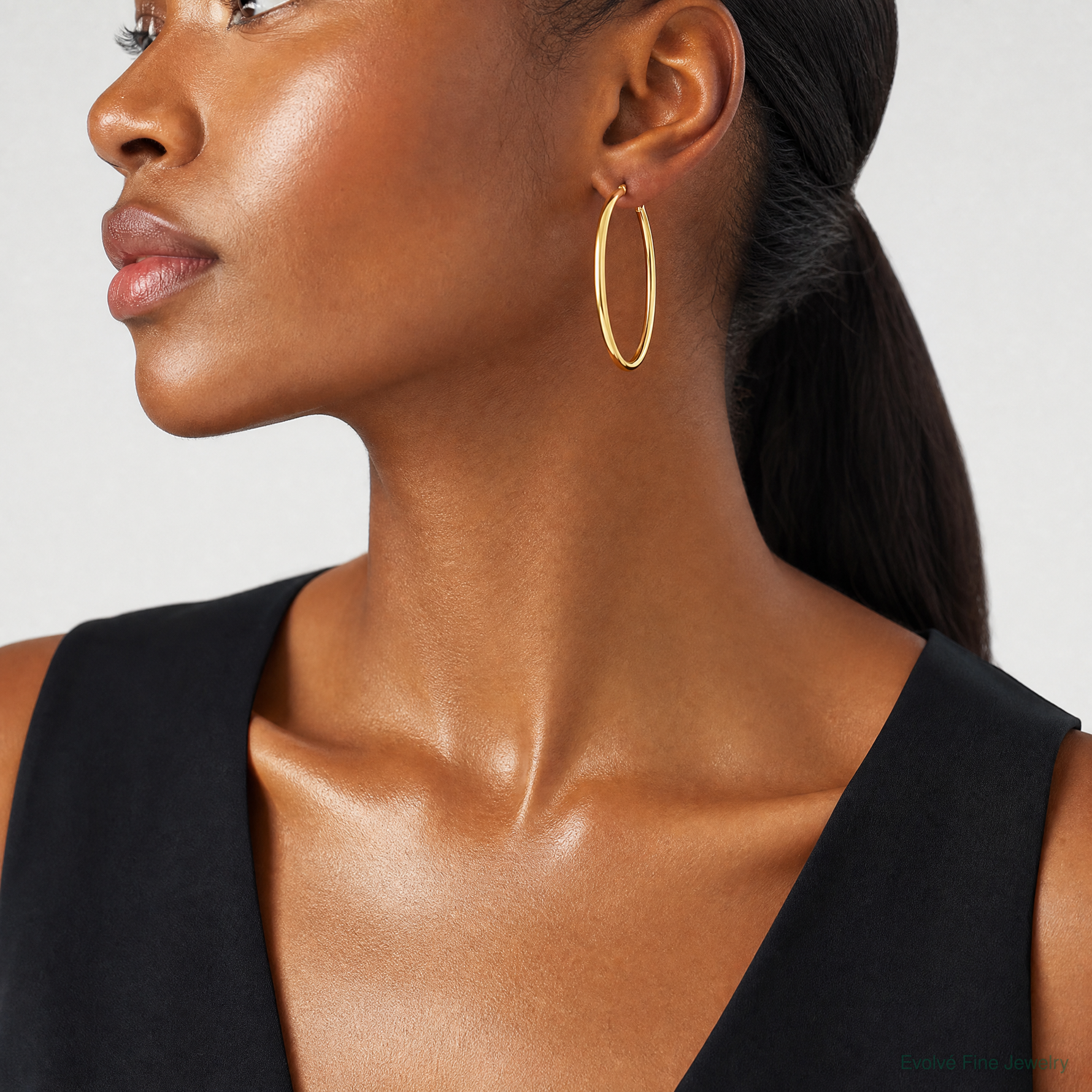 14k Polished 2x50mm  Lightweight Tube Hoop Earrings - Model Shot