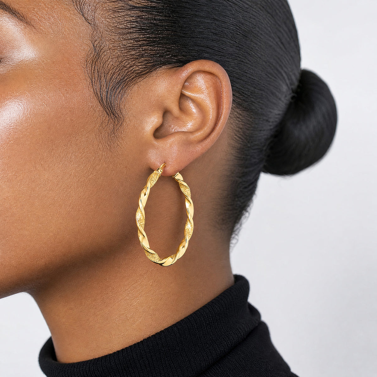 14K Polished and Textured Twisted Hoop Earrings - Model Shot