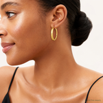 14K Polished Diamond-cut Hoop Earrings - Model Shot