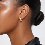 14K Polished and Diamond-cut Huggie Hoop Earrings - Model Shot