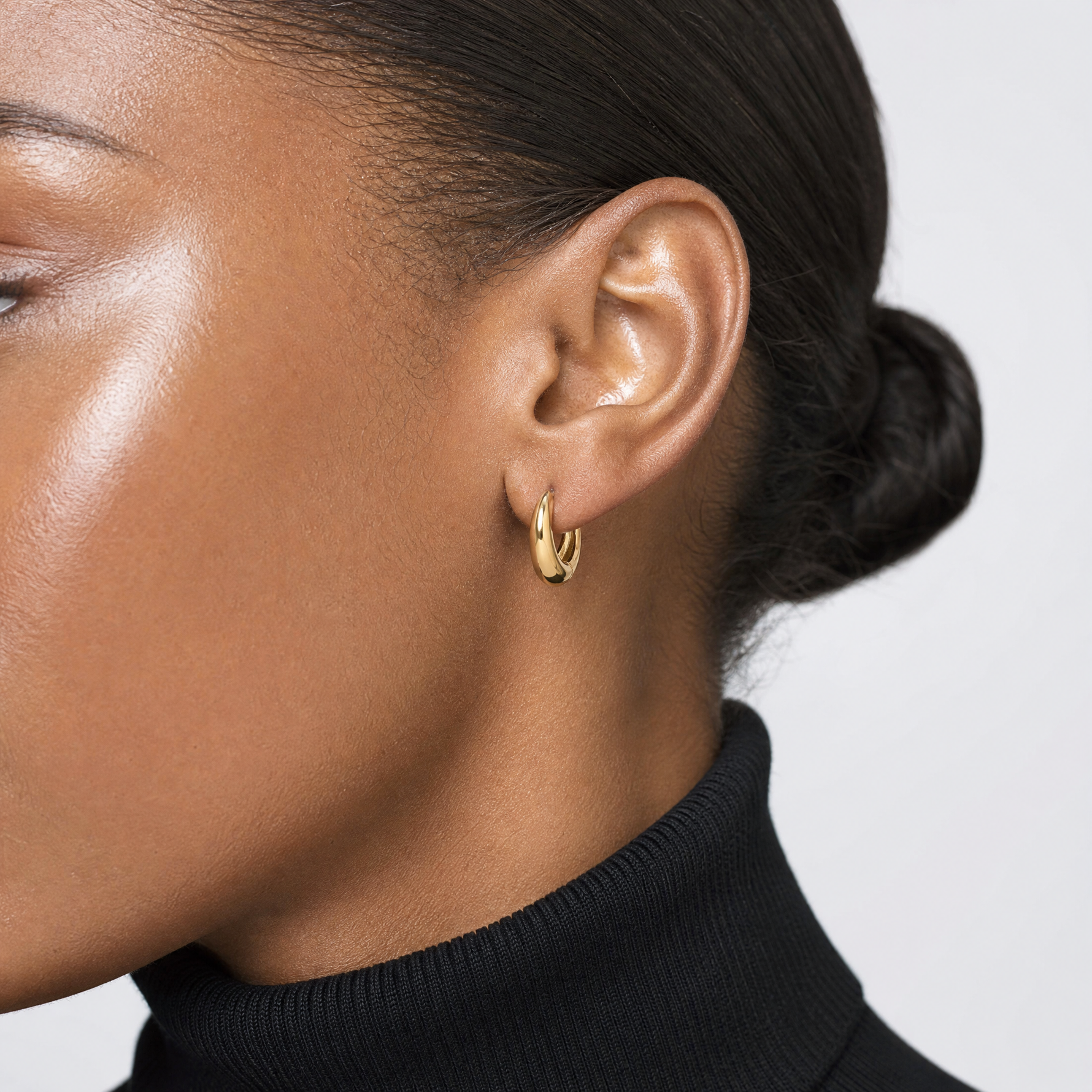 14K Polished Hinged Huggie Hoop Earrings - Model Shot
