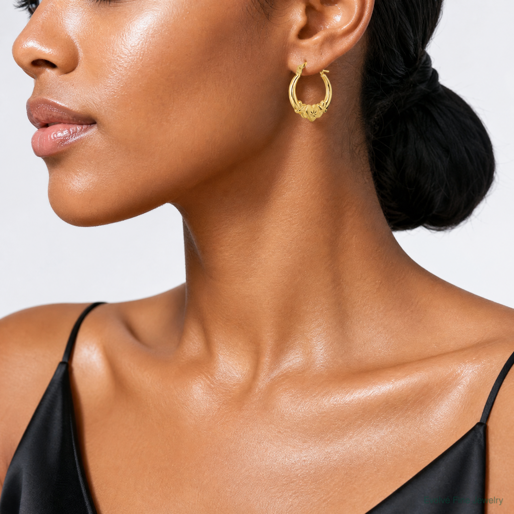 14k Polished Brushed and Diamond-cut Heart Hoop Earrings - Model Shot