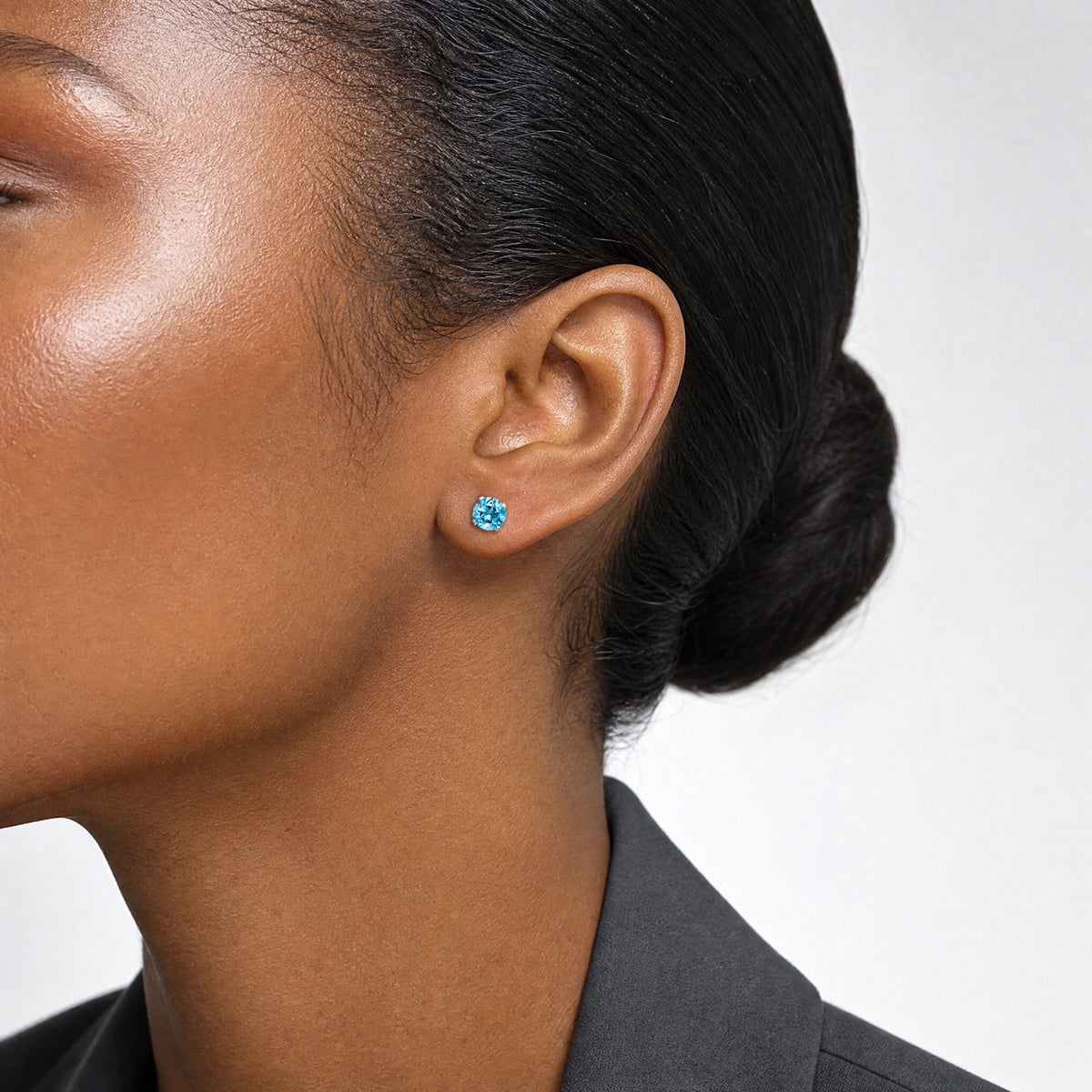 14k White Gold 5mm Blue Topaz Stud Earrings - Model Shot