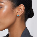 14k 5mm Blue Topaz Earrings - December - Model Shot