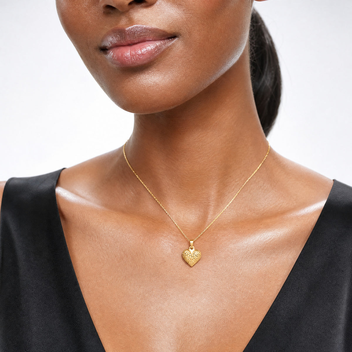 14k Polished Diamond-cut Medium Puffed Heart Pendant - Model Shot