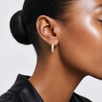 14k Polished CZ 4x16mm Huggie Hoop Earrings - Model Shot