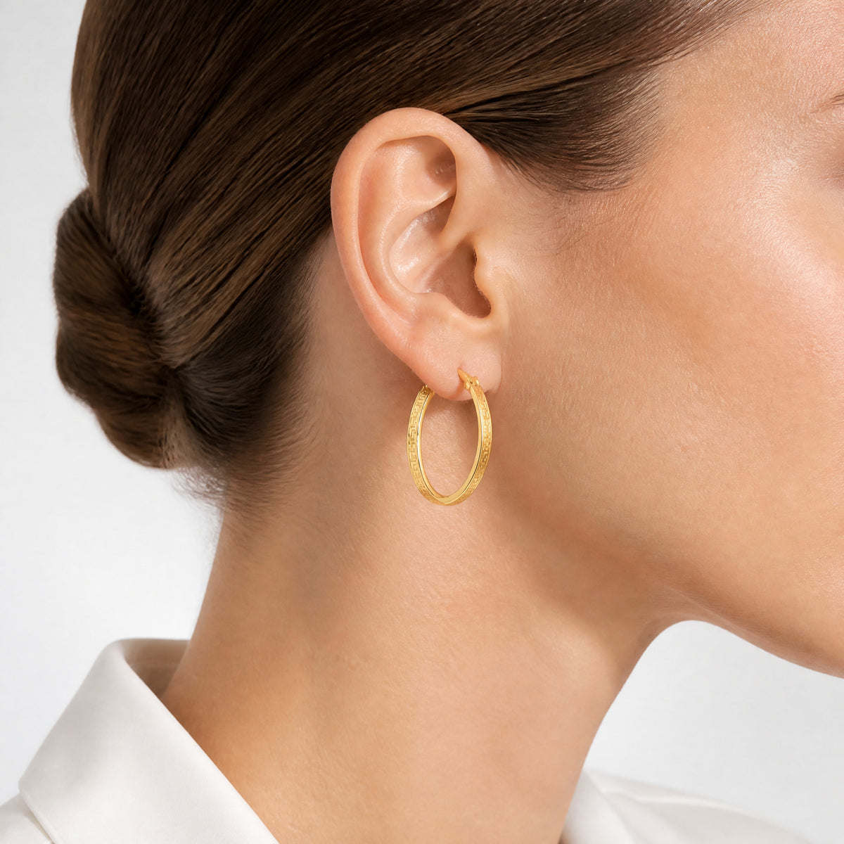 10k Polished Greek Key In/Out Square Tube Hoop Earrings - Model Shot