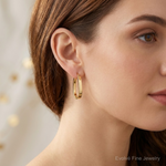 Leslie's 10K Polished U-Shape Hoop Earrings - Model Shot