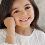 14k White Gold Polished Dangle Heart Baby Bracelet - Model Shot