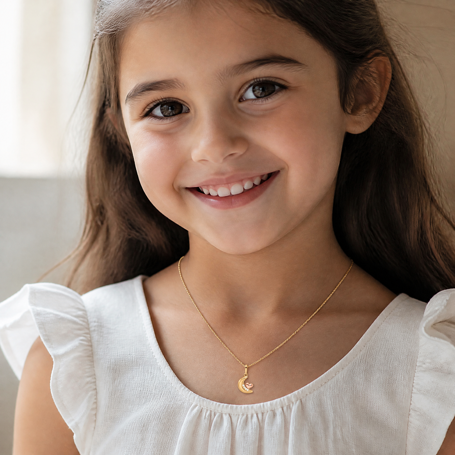14k Two-tone Madi K CZ Moon with Heart Pendant - Model Shot